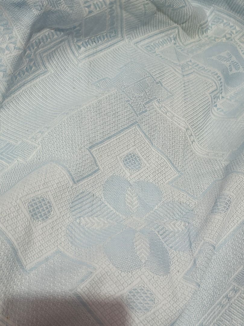 Light Blue Textured Table Cloth with Geometric Pattern (Category: Table Linen & Textiles) located in Makati City. Submitted by nyxhemera26 (Listing ID 1463677643, Image 3). Description: Light Blue Textured Table Cloth with Geometric Pattern - Textured geometric pattern (diamonds & floral motifs) - Subtle and nice design - 63 x 215 inches (perfect for 6 seater table) - There is slight fading/yellowing on the folds due to prolonged storage.
