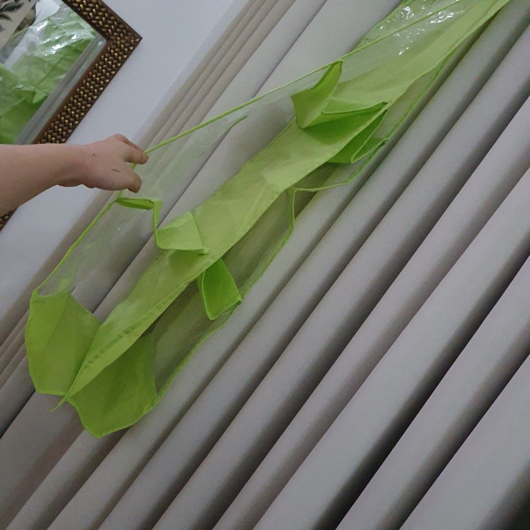 Lime Green Hanging Organizer with Clear Pockets (Category: Accessory Holder, Box & Organizers) located in Paranaque City. Submitted by cobien (Listing ID 1463650771, Image 3). Description: - Keep your space tidy with this versatile hanging organizer. - Features multiple clear pockets for easy visibility of contents. - Ideal for storing accessories, toiletries, craft supplies, and more. - Folds compactly for convenient storage when not in use. - C