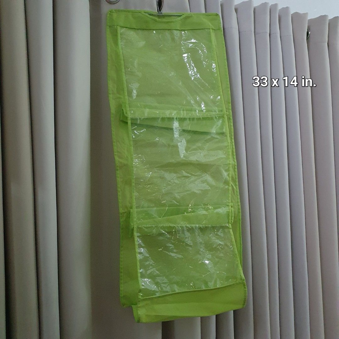 Lime Green Hanging Organizer with Clear Pockets (Category: Accessory Holder, Box & Organizers) located in Paranaque City. Submitted by cobien (Listing ID 1463650771, Image 1). Description: - Keep your space tidy with this versatile hanging organizer. - Features multiple clear pockets for easy visibility of contents. - Ideal for storing accessories, toiletries, craft supplies, and more. - Folds compactly for convenient storage when not in use. - C