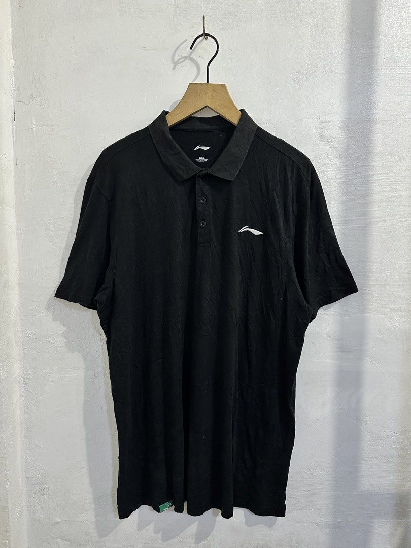 Li-Ning Black Polo Shirt (Category: Tshirts & Polo Shirts ) located in San Jose del Monte. Submitted by bizzybeebyhgc (Listing ID 1463623962, Image 1). Description: - Black Li-Ning Polo Shirt - Size: 21 x 29 - Material: 100% Cotton - Features: Li-Ning logo on chest, button closure at neck - Perfect for: Casual wear or sports - Versatile: Pairs easily with shorts or pants.
