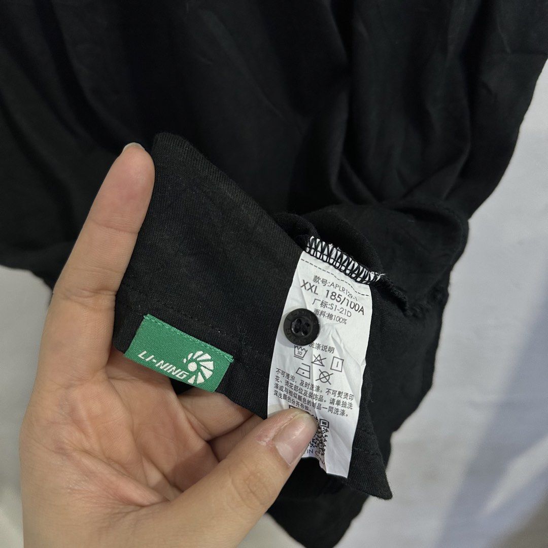Li-Ning Black Polo Shirt (Category: Tshirts & Polo Shirts ) located in San Jose del Monte. Submitted by bizzybeebyhgc (Listing ID 1463623962, Image 2). Description: - Black Li-Ning Polo Shirt - Size: 21 x 29 - Material: 100% Cotton - Features: Li-Ning logo on chest, button closure at neck - Perfect for: Casual wear or sports - Versatile: Pairs easily with shorts or pants.