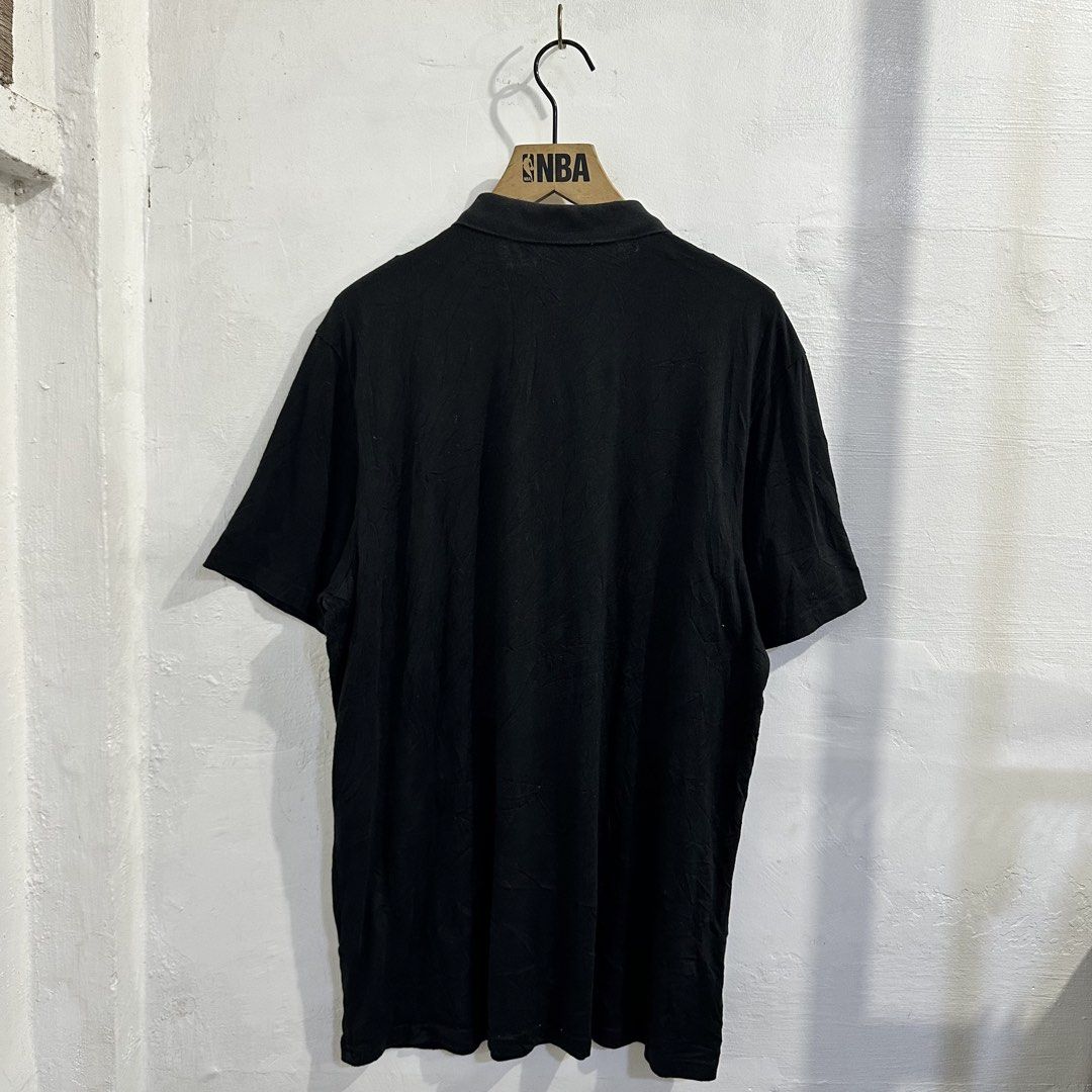 Li-Ning Black Polo Shirt (Category: Tshirts & Polo Shirts ) located in San Jose del Monte. Submitted by bizzybeebyhgc (Listing ID 1463623962, Image 3). Description: - Black Li-Ning Polo Shirt - Size: 21 x 29 - Material: 100% Cotton - Features: Li-Ning logo on chest, button closure at neck - Perfect for: Casual wear or sports - Versatile: Pairs easily with shorts or pants.