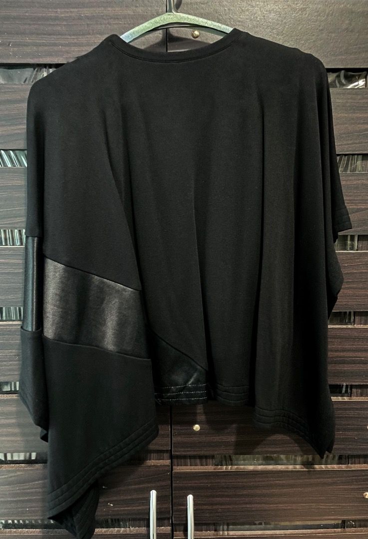 Loewe black asymmetric batwing blouse top (Category: Blouses) located in Quezon City. Submitted by angelbuena38328 (Listing ID 1463596352, Image 3). Description: Black Loewe batwing blouse with one side longer than the right side, has a heavy thick satin panel design. Size small to medium . Dry cleaned almost new Check out my other items . Constantly decluttering .