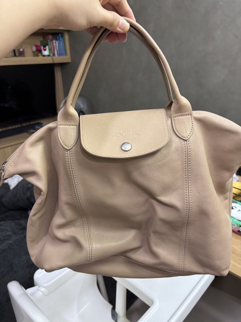 Longchamp Le Pliage Leather (Category: Luxury Bags & Wallets) located in Pasig City. Submitted by famlovestoshop (Listing ID 1463622380, Image 1). Description: Guaranteed authentic, bought in Rustans (but receipt is no longer available) Comes with paper bag.