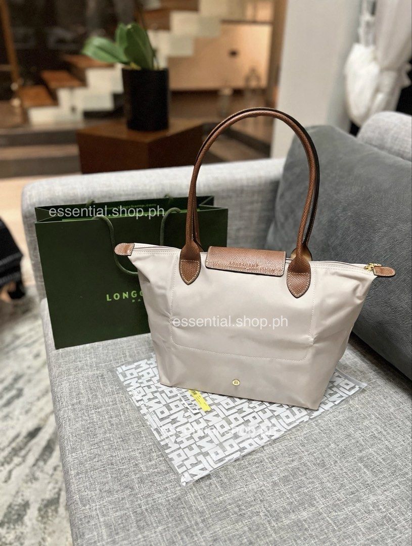 Longchamp Le Pliage Original Medium Long Handle in Paper (Category: Tote Bags) located in Manila. Submitted by essential.shop.ph (Listing ID 1463657476, Image 2). Description: FOR PRE-ORDER. 7-10 days ETA ☺️ Authentic Longchamp Le Pliage Original Medium Long Handle Paper (Actual color difficult to capture. Changes due to lighting.) Includes care card, LGP zip lock pouch and paper bag. Dimensions 28 cm (L - measured at the base of the bag) x 26,5 