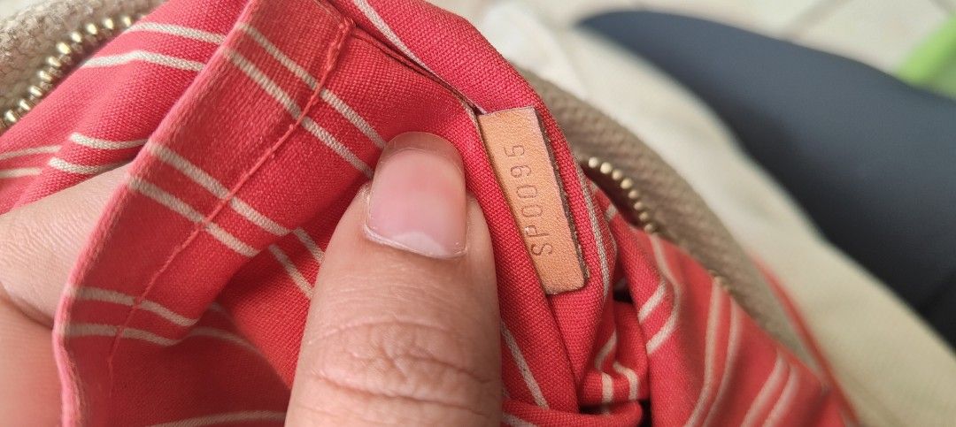 Louis Vuitton Antigua Cabas Tote Bag (Category: Luxury Bags & Wallets) located in Manila. Submitted by lennonmang06917 (Listing ID 1463558256, Image 2). Description: - Authentic Louis Vuitton tote bag - Color: Beige canvas with red trim and straps - Interior: Red and white striped lining - Closure: Zipper - Code: SP0095.