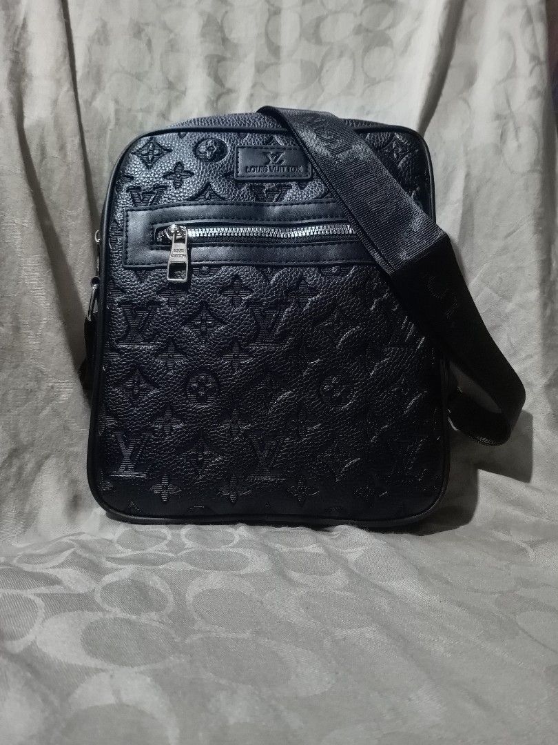 Louis Vuitton Black Monogram Embossed Crossbody Bag (Category: Luxury Bags & Wallets) located in Aguinaldo. Submitted by ukayandthrift (Listing ID 1463603235, Image 1). Description: - Louis Vuitton crossbody bag - Iconic monogram pattern embossed all over - Zippered front pocket for quick access - Spacious main compartment for your essentials - Branded Louis Vuitton strap - Ideal for everyday use and stylish on-the-go.