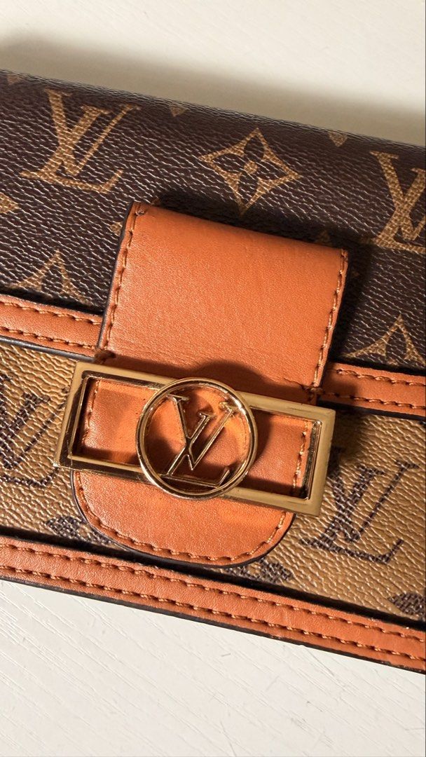Louis Vuitton Monogram Canvas Dauphine Chain Wallet (Category: Luxury Bags & Wallets) located in Batangas. Submitted by cjayf (Listing ID 1463599831, Image 3). Description: - Cute crossbody bag with classic monogram print - Secure gold buckle closure - Detachable gold chain strap for versatile styling - Ideal for carrying your daily essentials - Chic and stylish accessory .