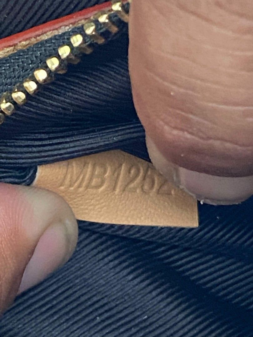 Louis Vuitton Monogram Canvas Crossbody Bag (Category: Luxury Bags & Wallets) located in Bacolod City. Submitted by carlo1019 (Listing ID 1463611954, Image 3). Description: - Authentic Louis Vuitton crossbody bag - Classic monogram canvas with tan leather trim and strap - Gold hardware - Interior is lined - Made in France - Date code: MB1252 - Ideal everyday bag.