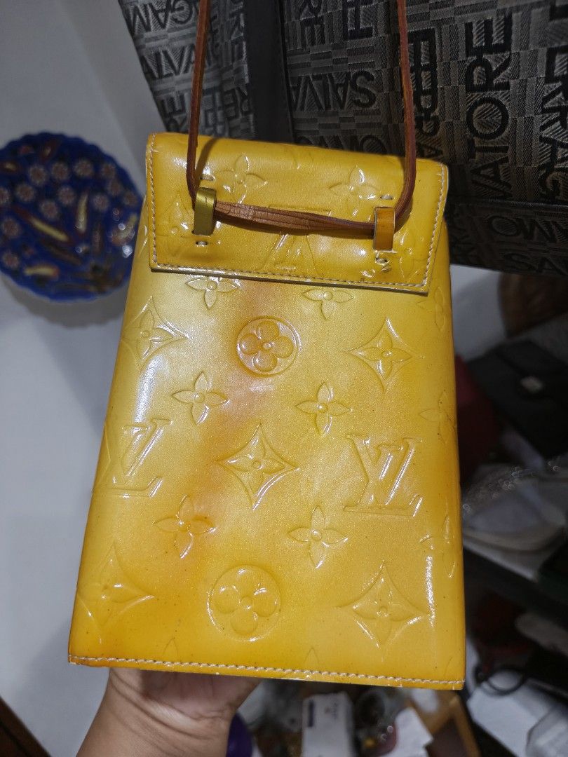 Louis Vuitton Monogram Vernis Walker (Category: Luxury Bags & Wallets) located in Paranaque City. Submitted by bagdbags (Listing ID 1463687837, Image 3). Description: - Authentic Yellow Louis Vuitton Vernis Walker - Features iconic LV monogram embossed pattern - Secure snap button closure - Adjustable strap for comfortable wear - Exterior shows some signs of wear, particularly on edges and snap button area - Interior is clean and well-maintained 