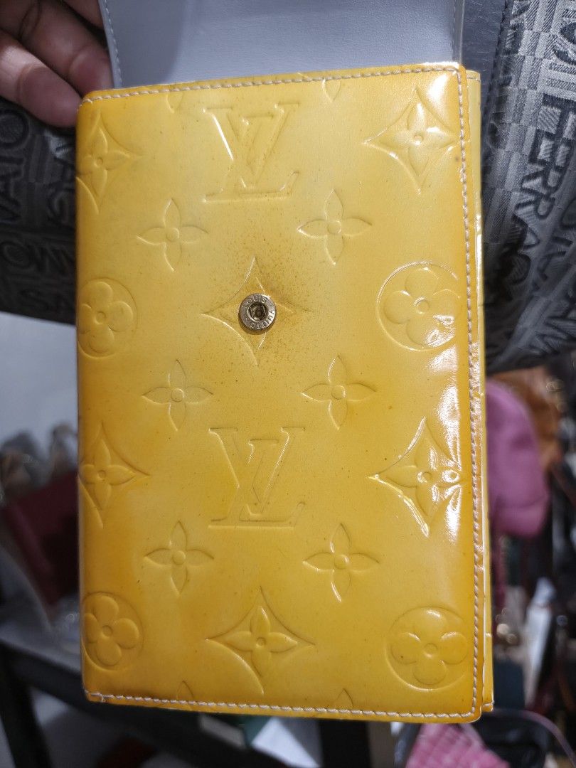 Louis Vuitton Monogram Vernis Walker (Category: Luxury Bags & Wallets) located in Paranaque City. Submitted by bagdbags (Listing ID 1463687837, Image 2). Description: - Authentic Yellow Louis Vuitton Vernis Walker - Features iconic LV monogram embossed pattern - Secure snap button closure - Adjustable strap for comfortable wear - Exterior shows some signs of wear, particularly on edges and snap button area - Interior is clean and well-maintained 
