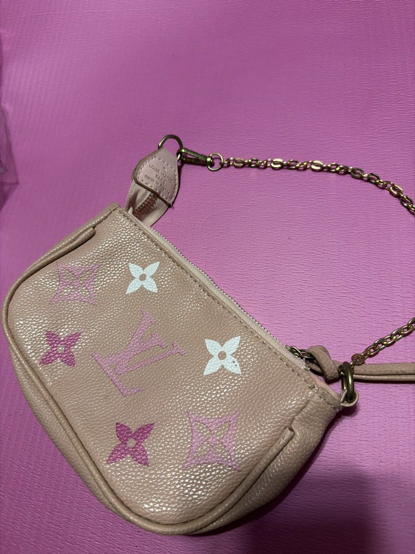 Louis Vuitton Pink Monogram Pouch Bag with Chain (Category: Luxury Bags & Wallets) located in Manila. Submitted by salvadorsh41571 (Listing ID 1463706342, Image 1). Description: - Authentic Louis Vuitton pouch bag - Classic monogram print in pink and white - Features a chic gold chain strap - Ideal for carrying essentials - Versatile for evenings out or daily use.