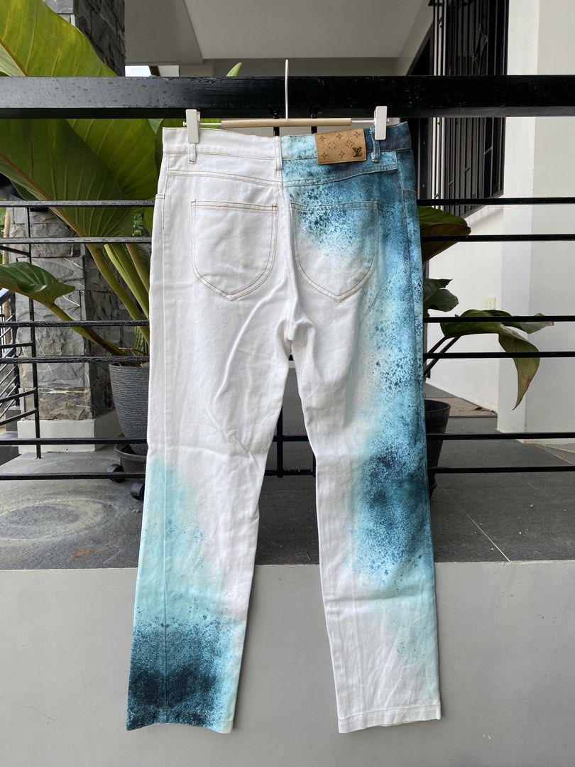 Louis Vuitton Spray Paint Jeans (Category: Jeans) located in Roxas City. Submitted by dua-garments23 (Listing ID 1463605115, Image 2). Description: - White denim jeans with a cool blue spray paint effect. - Authentic Louis Vuitton branding on the back pocket tab and leather patch. - Stylish straight leg fit. - Secure button and zip closure..