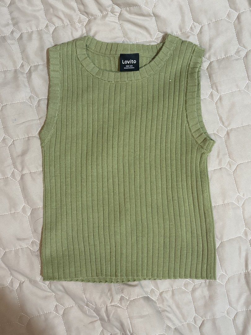 Lovito Ribbed Sleeveless Top - Green (Category: Sleeveless) located in Pasig City. Submitted by vhasibuan (Listing ID 1463668969, Image 1). Description: - Lovito green ribbed sleeveless top - One size fits most - Stretchy and comfortable material - Raw edge hem finish - Versatile for layering or wearing alone - Easy to pair with jeans or skirts for a casual look.