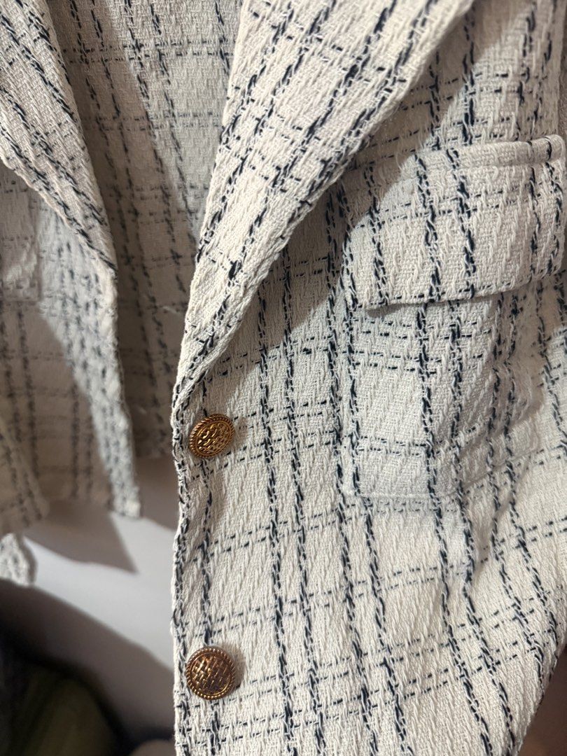 Lovito Tweed Cropped Jacket (Category: Coats, Jackets and Outerwear) located in Quezon City. Submitted by shuartcake (Listing ID 1463697683, Image 3). Description: - Cute cropped tweed jacket from Lovito - White with navy blue plaid pattern - Features two front pockets - Stylish gold button details - Ideal for layering over tops for a chic look - Only used once.