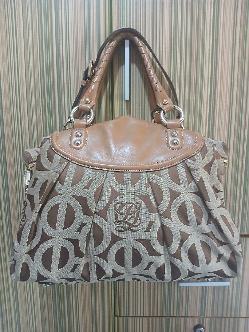 LQ Monogram Canvas Leather Trimmed Handbag (Category: Luxury Bags & Wallets) located in Taguig. Submitted by demsclosetph (Listing ID 1463618079, Image 3). Description: - Authentic LQ monogram canvas handbag - Classic brown and beige colorway - Elegant tan leather trim - Comfortable braided handles - Secure zipper closure - Gold-tone hardware - Spacious interior, ideal for everyday essentials - Timeless and versatile design.