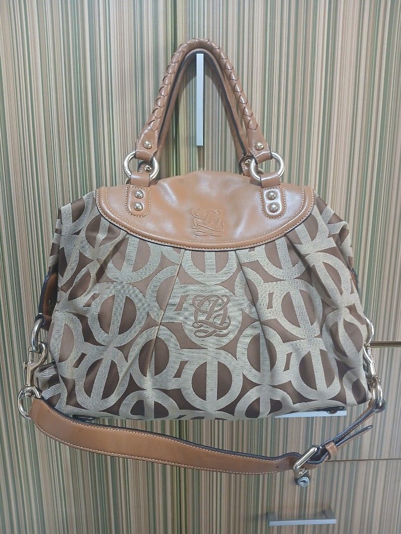 LQ Monogram Canvas Leather Trimmed Handbag (Category: Luxury Bags & Wallets) located in Taguig. Submitted by demsclosetph (Listing ID 1463618079, Image 1). Description: - Authentic LQ monogram canvas handbag - Classic brown and beige colorway - Elegant tan leather trim - Comfortable braided handles - Secure zipper closure - Gold-tone hardware - Spacious interior, ideal for everyday essentials - Timeless and versatile design.