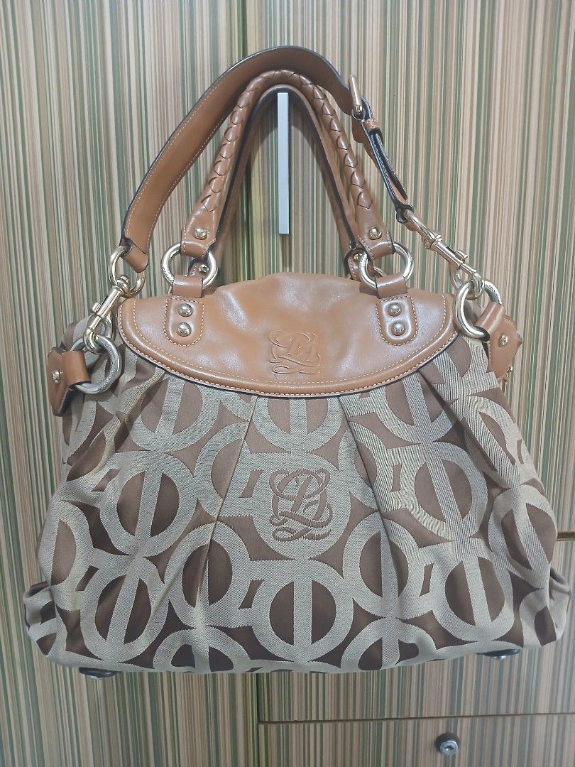 LQ Monogram Canvas Leather Trimmed Handbag (Category: Luxury Bags & Wallets) located in Taguig. Submitted by demsclosetph (Listing ID 1463618079, Image 2). Description: - Authentic LQ monogram canvas handbag - Classic brown and beige colorway - Elegant tan leather trim - Comfortable braided handles - Secure zipper closure - Gold-tone hardware - Spacious interior, ideal for everyday essentials - Timeless and versatile design.
