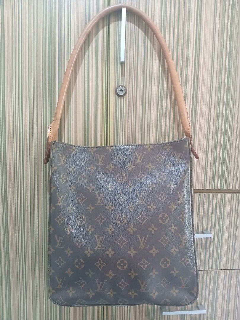LV Monogram Canvas Shoulder Bag (Category: Luxury Bags & Wallets) located in Taguig. Submitted by demsclosetph (Listing ID 1463619230, Image 1). Description: - monogram canvas shoulder bag - Tan leather strap - Spacious interior, perfect for everyday use.
