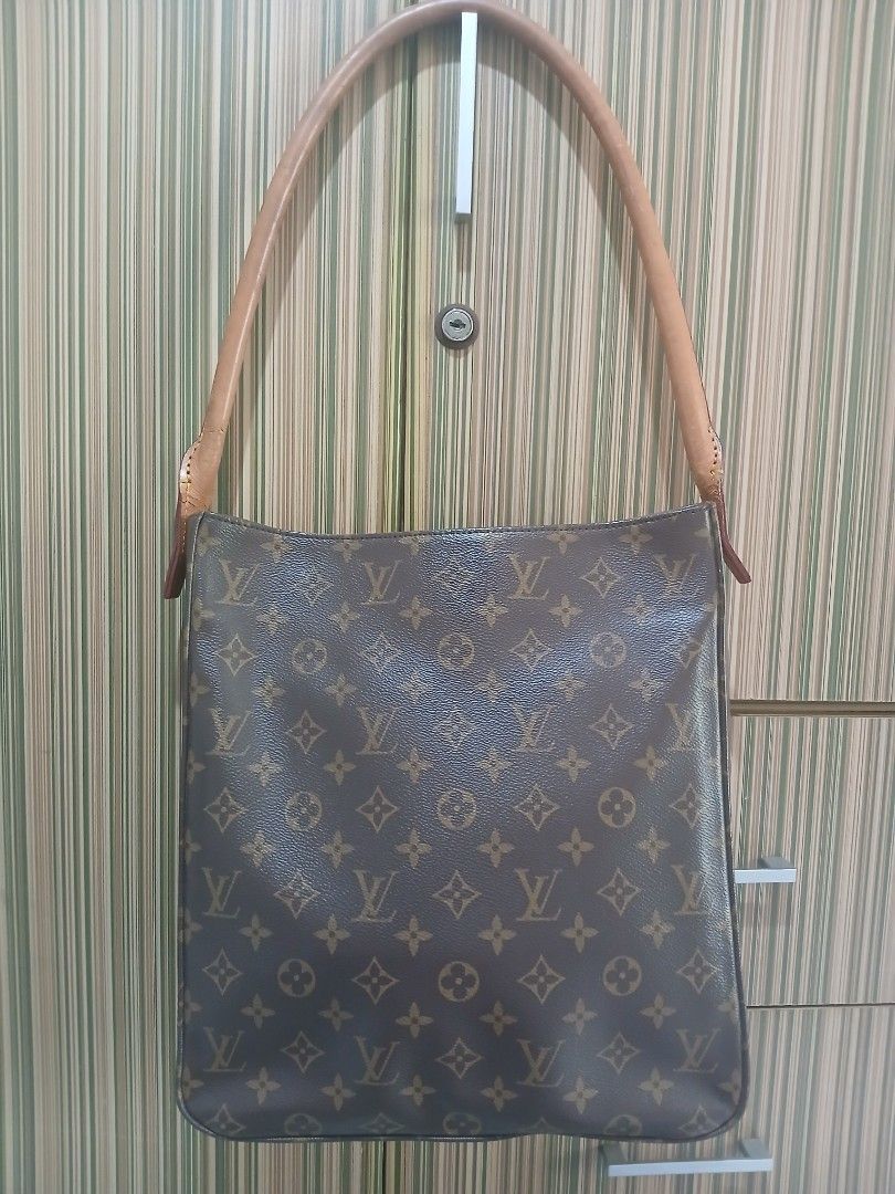 LV Monogram Canvas Shoulder Bag (Category: Luxury Bags & Wallets) located in Taguig. Submitted by demsclosetph (Listing ID 1463619230, Image 2). Description: - monogram canvas shoulder bag - Tan leather strap - Spacious interior, perfect for everyday use.