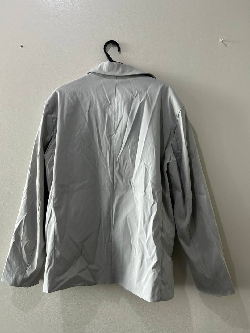 MANFINITY Gray Suit Set (Category: Coats, Jackets and Outerwear) located in Taguig. Submitted by MoveQuickly (Listing ID 1463627566, Image 2). Description: - MANFINITY Suit Set - Includes single-button blazer and matching pants - Blazer features 2 front pockets and black inner lining - Size: Pants: 38W x 18L | Blazer: 20W x 29L.