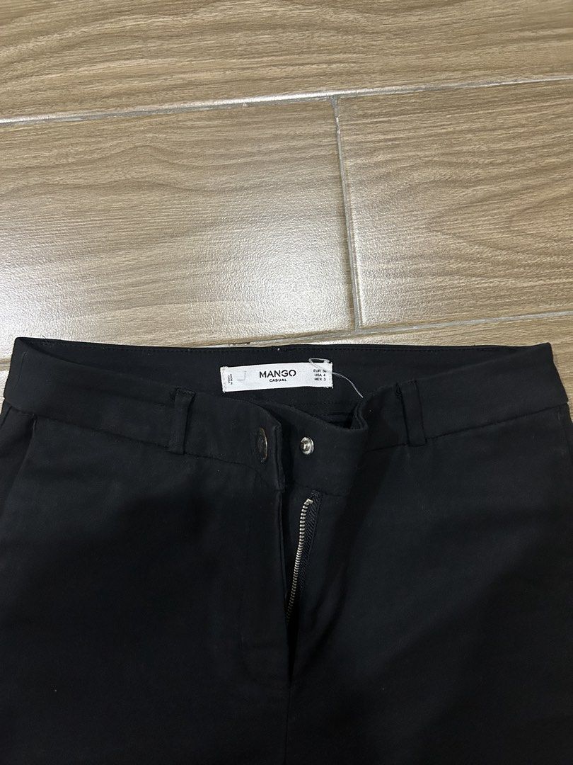Mango Black Slacks (Category: Other Bottoms) located in San Juan City. Submitted by curatedbymae (Listing ID 1463678875, Image 2). Description: Mango Black Slacks - waist: 13.5 in. - length: 39.5 in. - with side pockets Size: 36 Mode of Payment: GCASH/MAYA Shipping: J&T/Lalamove/Grab (Buyer will shoulder the shipping fee.).