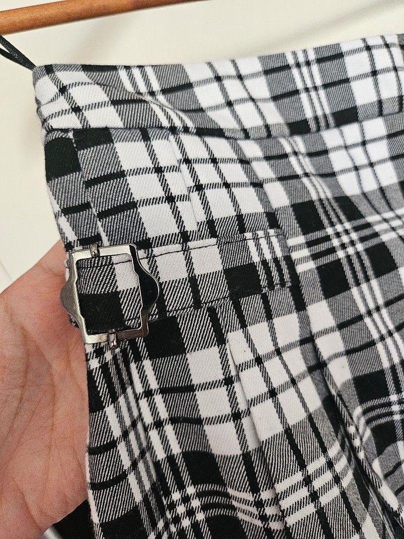 Mango Plaid Pleated Mini Skirt Size S (Category: Skirts) located in Taguig. Submitted by ynalorenzo (Listing ID 1463618153, Image 2). Description: - MNG black and white plaid mini skirt - Features a pleated design - Buckle details for added style - Convenient side zipper closure.