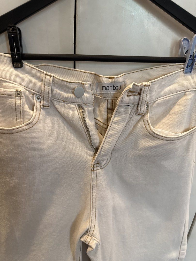 Mantou Cream Straight Leg Jeans (Category: Jeans) located in Manila. Submitted by andromedanny (Listing ID 1463611428, Image 2). Description: - Cream colored wide leg jeans - Brand: Mantou (Local!) - Closure: Button and zip - Pockets: Two front, two back - Detail: Brown stitching - RFS: Decluttering.