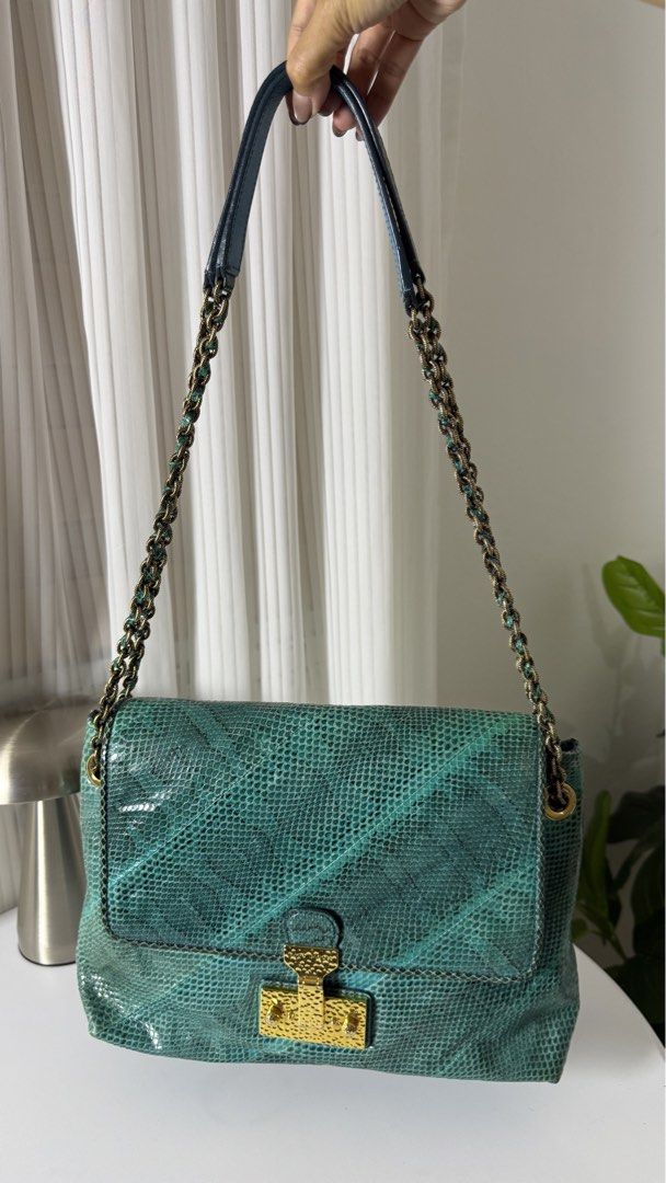 MARC JACOBS Python Leather Chain Baroque Bag (Category: Luxury Bags & Wallets) located in General Trias. Submitted by lexluxebizz (Listing ID 1463603995, Image 2). Description: RARE! MARC JACOBS Python Leather Chain Baroque Bag XL Made in Italy. (Original Price: Php 204,000++) This is an authentic Marc Jacobs Python Leather Baroque Shoulder Bag. This luxury piece features an exotic teal and green python skin exterior paired with a solid teal leat