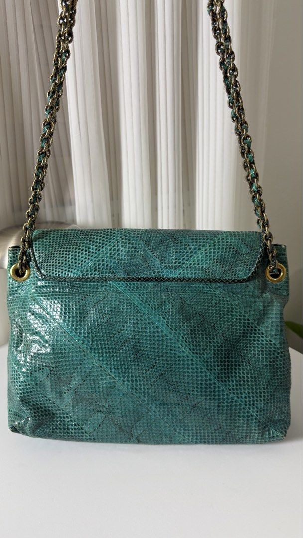 MARC JACOBS Python Leather Chain Baroque Bag (Category: Luxury Bags & Wallets) located in General Trias. Submitted by lexluxebizz (Listing ID 1463603995, Image 3). Description: RARE! MARC JACOBS Python Leather Chain Baroque Bag XL Made in Italy. (Original Price: Php 204,000++) This is an authentic Marc Jacobs Python Leather Baroque Shoulder Bag. This luxury piece features an exotic teal and green python skin exterior paired with a solid teal leat
