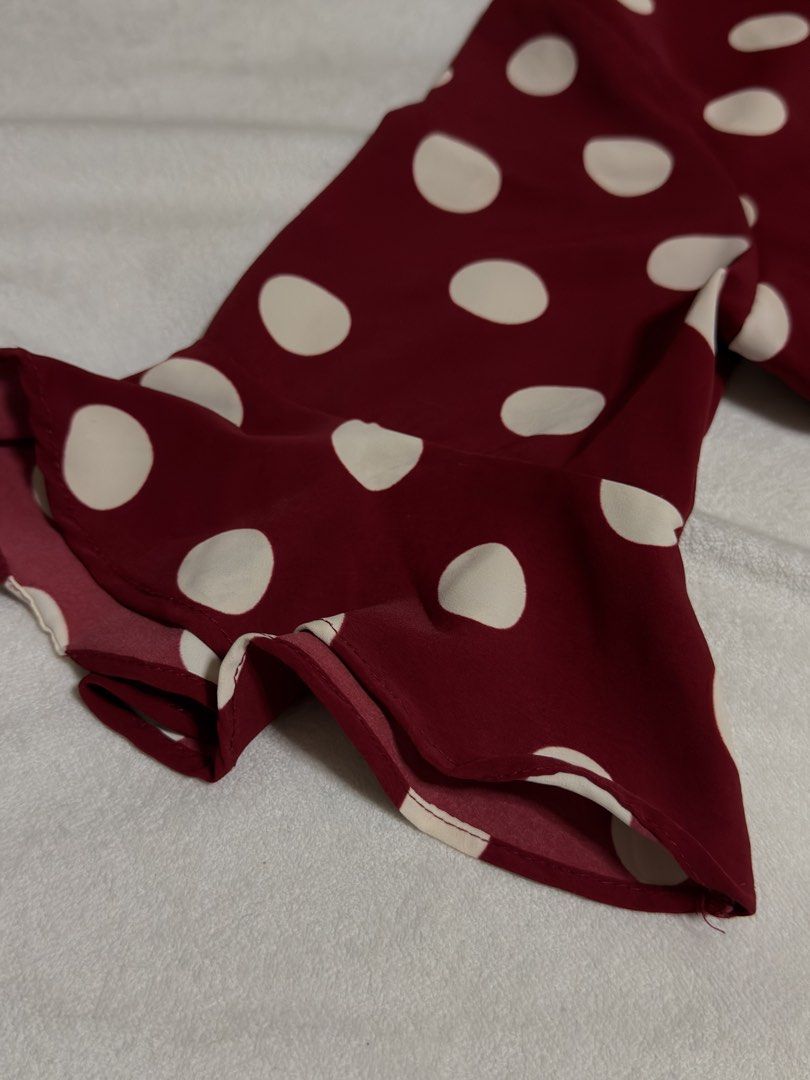 Maroon Polka Dot Ruffle Dress (Medium) (Category: Dresses) located in Cebu City. Submitted by eynjlin (Listing ID 1463689524, Image 3). Description: - Adorable maroon dress with classic white polka dots. - Features charming ruffled details on the skirt and sleeves. - Flattering V-neckline with a convenient back zipper closure. - Made from lightweight, flowy fabric for comfortable wear. - Versatile style, ideal for parties or casual outings. - Des