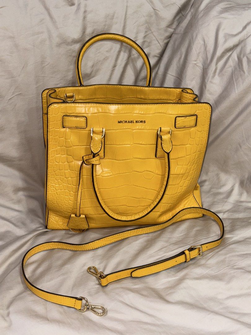 Michael Kors | Yellow Croc Embossed Leather Tote Bag (Category: Luxury Bags & Wallets) located in Muntinlupa City. Submitted by diananeedsspace (Listing ID 1463597281, Image 1). Description: - Authentic Michael Kors tote bag in a vibrant yellow. - Luxurious croc-embossed leather. - Versatile carrying options: comfortable top handles and a detachable shoulder strap. - Organized interior with multiple compartments and a secure zip pocket. - Elegant