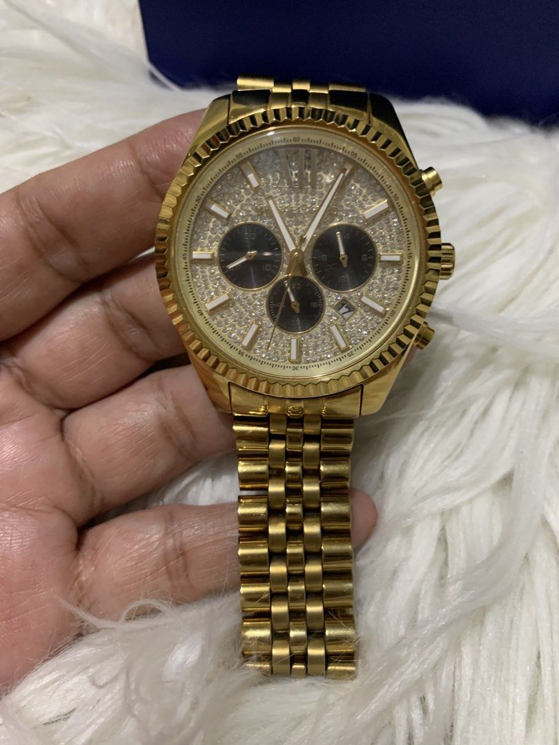 Michael Kors Gold Chronograph Watch (Category: Men's Watches) located in Paranaque City. Submitted by declutterby4angels (Listing ID 1463727902, Image 1). Description: - Authentic Michael Kors Gold Watch - Chronograph function with date display - Beautiful crystal-embellished dial - Durable stainless steel band with secure deployant clasp - Michael Kors logo details on clasp and case back - Water resistant up to 10 ATM (suitable for swimming and 