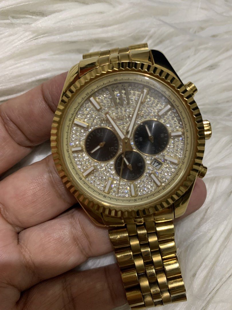 Michael Kors Gold Chronograph Watch (Category: Men's Watches) located in Paranaque City. Submitted by declutterby4angels (Listing ID 1463727902, Image 2). Description: - Authentic Michael Kors Gold Watch - Chronograph function with date display - Beautiful crystal-embellished dial - Durable stainless steel band with secure deployant clasp - Michael Kors logo details on clasp and case back - Water resistant up to 10 ATM (suitable for swimming and 