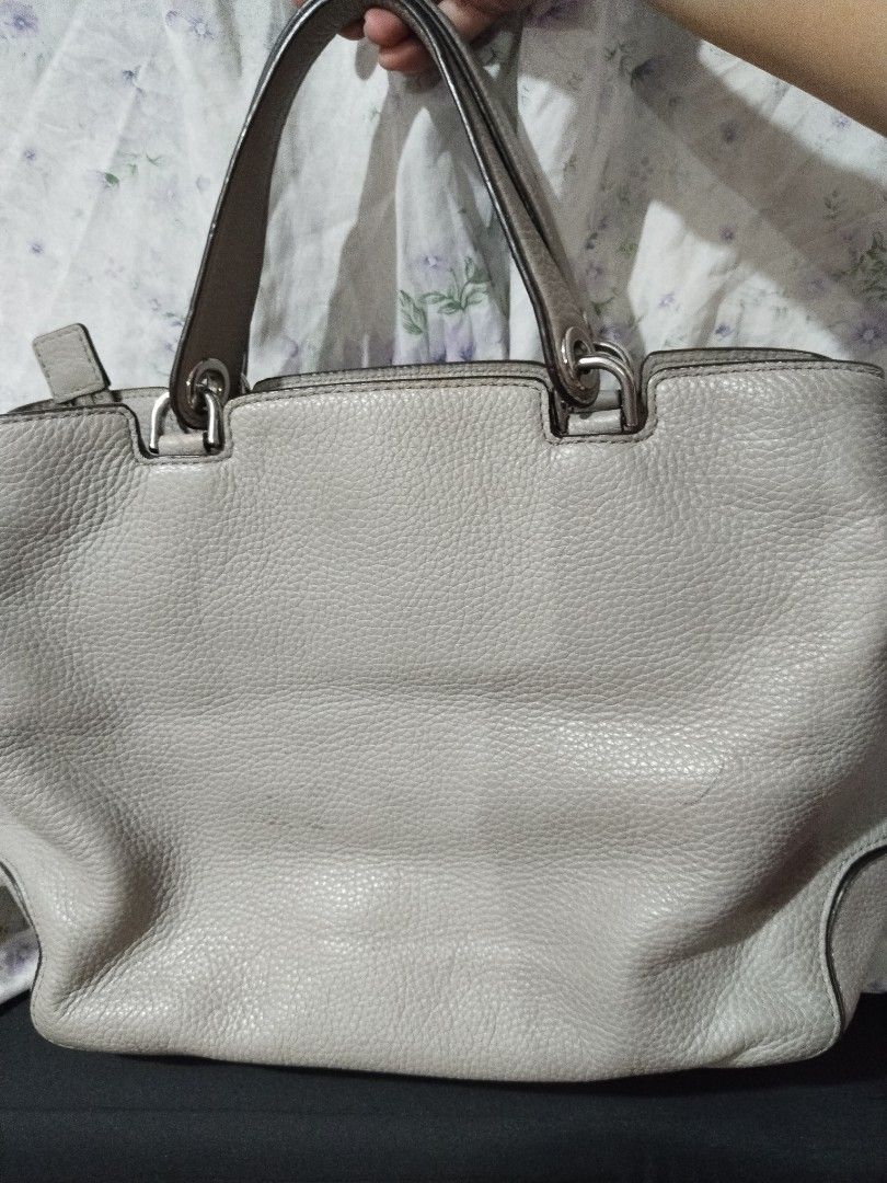 Michael Kors Grey Leather Tote Handbag (Category: Tote Bags) located in Quezon City. Submitted by goshen24 (Listing ID 1463669516, Image 3). Description: - Brand: Michael Kors - Material: Grey pebbled leather - Style: Tote bag - Hardware: Silver-tone - Interior: Multiple zip and slip pockets - Ideal for: Everyday use original minimal stain.