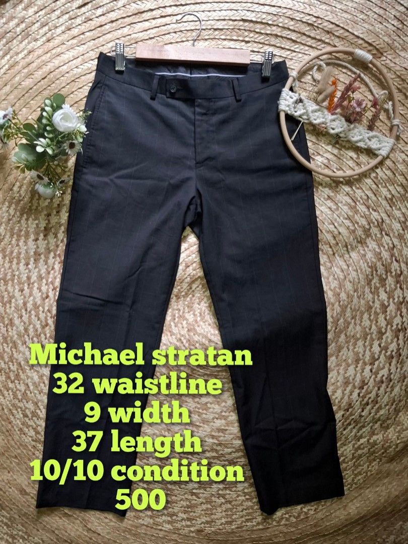 Michael Strahan Striped Dress Pants (Category: Trousers) located in Bulacan. Submitted by cathycampo51092 (Listing ID 1463679508, Image 1). Description: - Brand: Michael Strahan - Type: Dress Pants - Size: 32 Waist, 9 Rise, 37 Length - Color: Dark with subtle pinstripes - Style: Suitable for formal or business casual occasions.