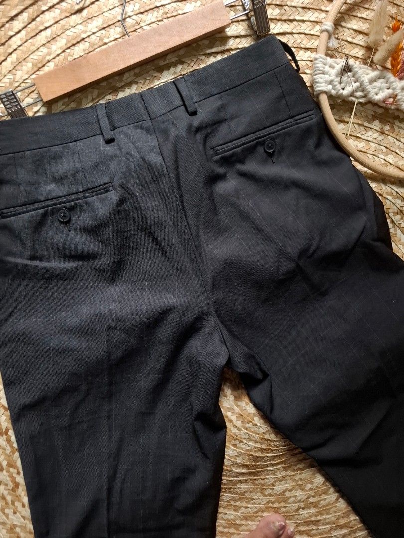 Michael Strahan Striped Dress Pants (Category: Trousers) located in Bulacan. Submitted by cathycampo51092 (Listing ID 1463679508, Image 3). Description: - Brand: Michael Strahan - Type: Dress Pants - Size: 32 Waist, 9 Rise, 37 Length - Color: Dark with subtle pinstripes - Style: Suitable for formal or business casual occasions.
