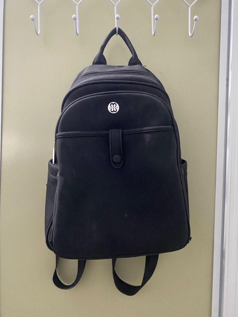 Michaela Black Leather Backpack (Category: Backpacks) located in Caloocan City. Submitted by letharellano__71 (Listing ID 1463700279, Image 1). Description: - Brand: Michaela - Color: Black - Material: Faux Leather - Features: Front pocket with snap closure, side pockets - Straps: Top handle and adjustable shoulder straps - Ideal for: Everyday use.