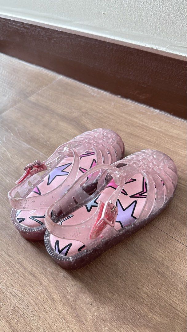 Mini Melissa Pink Jelly Star Sandals (Category: Babies & Kids Fashion) located in Taguig. Submitted by bpyte0408 (Listing ID 1463595522, Image 2). Description: Mini Melissa Pink Jelly Sandals - 100% Authentic - Size: 27 EUR / 10 USA - Good condition.