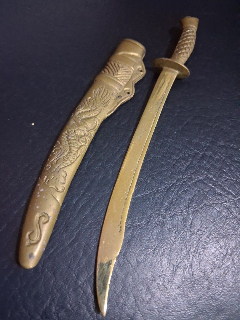 Miniature Century Brass Dragon Sword (Category: Vintage Collectibles) located in Mandaluyong City. Submitted by daddyjpanlilio24 (Listing ID 1463707092, Image 3). Description: P 1100+sf Length 8.5" No issue Mandaluyong Shipping/Payment: Gcash/Maya Jnt payment 1st no cod Lalamove payment upon rider pick up.