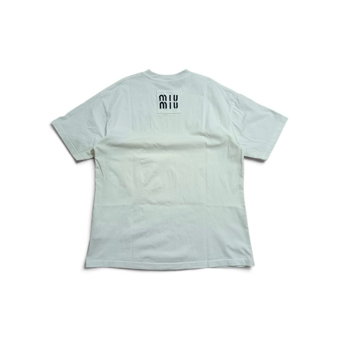 Miu Miu (Category: Tshirts & Polo Shirts ) located in Manila. Submitted by southstreethub.ph (Listing ID 1463675445, Image 2). Description: - Miu Miu - Size: XL - Dimention: 22.5 Width 30 Lenght - Features signature logo on front and back - Made in Italy - Simple and stylish design - Ideal for everyday wear.