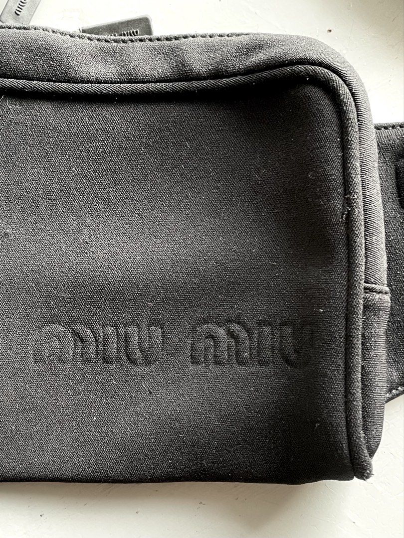 Miu Miu - Prada Neoprene Waist Bag (Category: Luxury Bags & Wallets) located in San Fernando. Submitted by larchivefeminine (Listing ID 1463700529, Image 3). Description: Miu Miu - Prada Neoprene Waist Bag SS 1999 VERY GOOD VINTAGE CONDITION MADE IN ITALY COLOR: BLACK ZIPPER: LAMPO MATERIAL: WOVEN NYLON WEBBING .