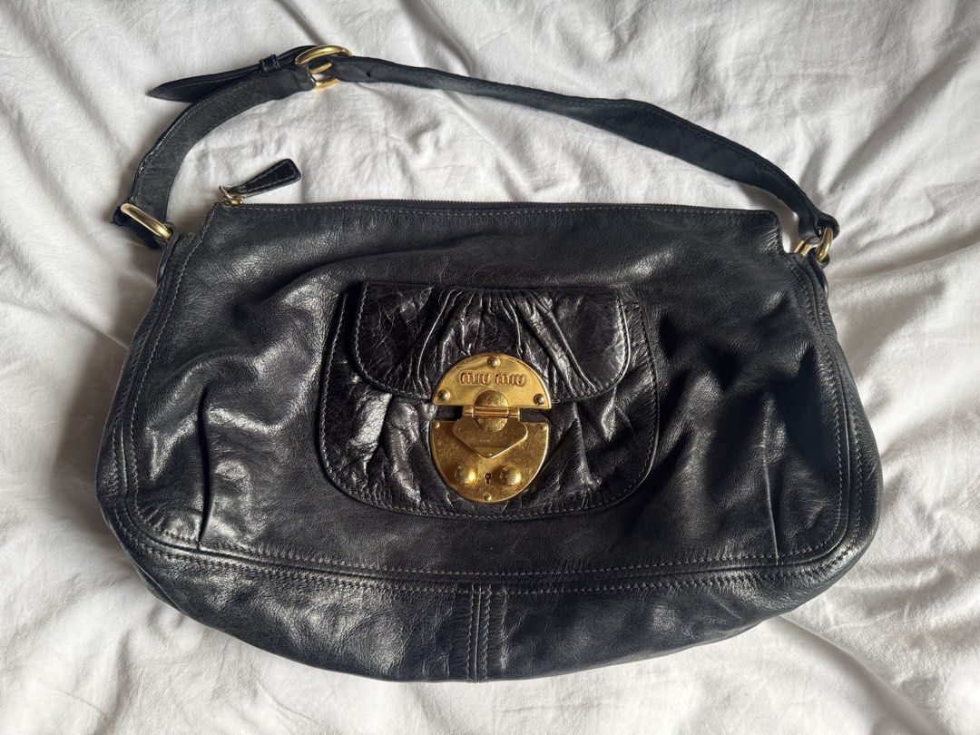 Miu Miu Black Leather Shoulder Bag (Category: Shoulder Bags) located in Manila. Submitted by thevintage90_sretro. (Listing ID 1463670768, Image 1). Description: legit dm for inquiries.