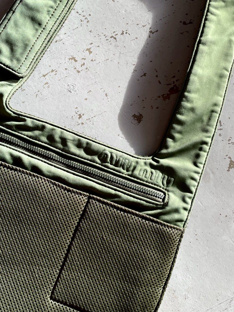 Miu Miu Mesh Crossbody Bag (Category: Luxury Bags & Wallets) located in San Fernando. Submitted by larchivefeminine (Listing ID 1463700243, Image 2). Description: Miu Miu Mesh Crossbody Bag SS 1999 VERY GOOD VINTAGE CONDITION NORMAL SIGNS OF WEAR FOR VINTAGE MADE IN ITALY COLOR: GREEN / OLIVE GREEN ZIPPER: RIRI MATERIAL: BALLISTIC MESH FABRIC OVERLY .