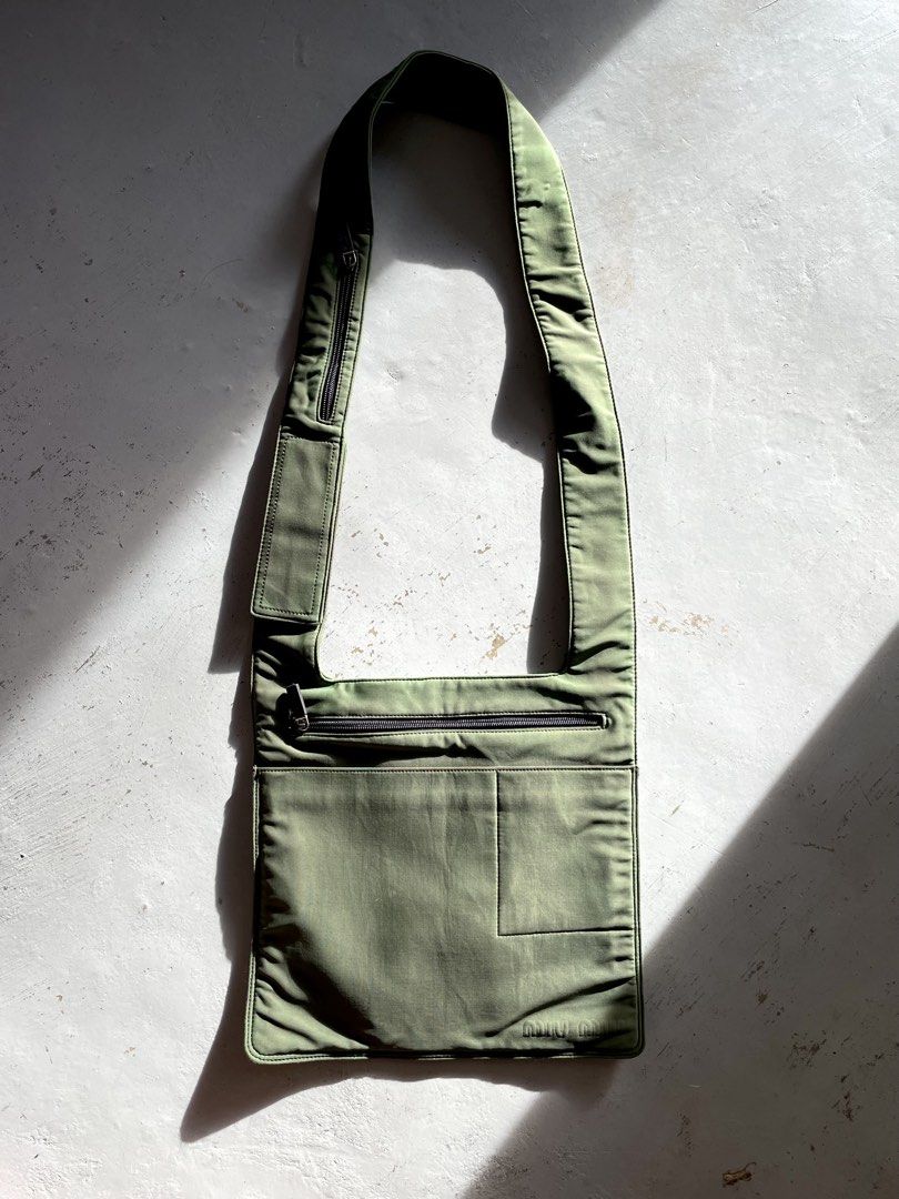 Miu Miu Technical Nylon Cross Body Bag (Category: Luxury Bags & Wallets) located in San Fernando. Submitted by larchivefeminine (Listing ID 1463699928, Image 1). Description: Miu Miu Technical Nylon Cross Body Bag SS 1999 VERY GOOD VINTAGE CONDITION MADE IN ITALY COLOR: GREEN / OLIVE GREEN ZIPPER: LAMPO MATERIAL: TECHNICAL NYLON FABRIC .