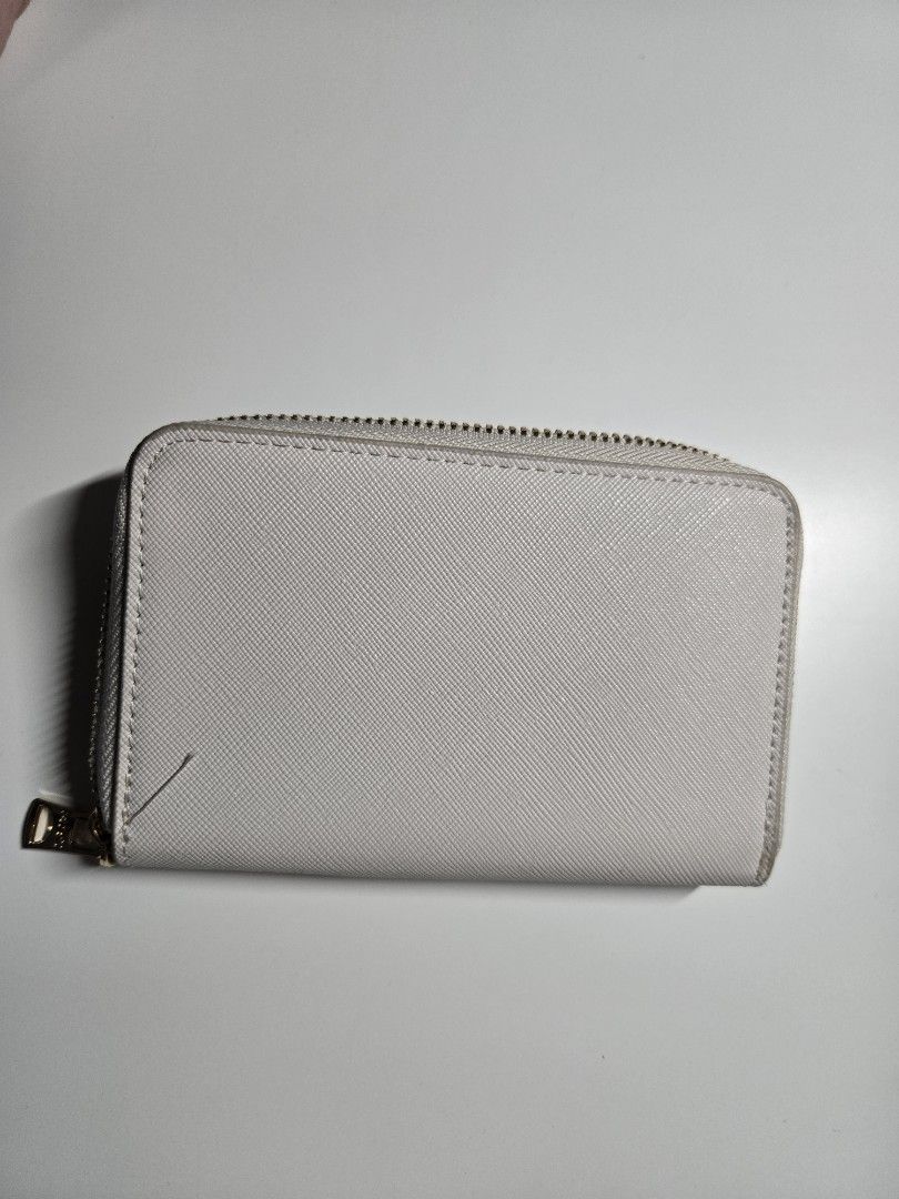 MNG Zip Around Wallet (Category: Wallets & Card holders) located in Cagayan de Oro. Submitted by itsnaja (Listing ID 1463691895, Image 3). Description: - White MNG wallet - Zip-around closure - Multiple card slots - Zippered compartment in the middle - Gold hardware - Clean interior - Great for organizing essentials.