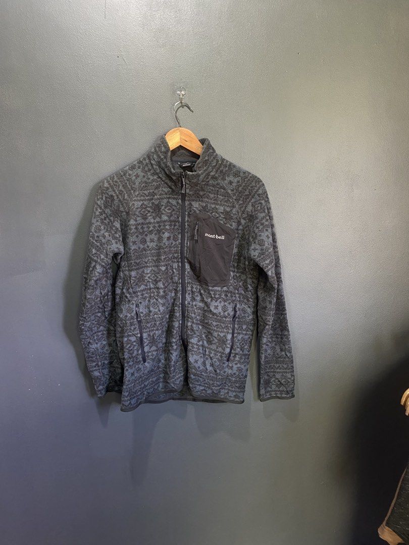 Montbell Fleece Jacket Size M - Patterned (Category: Coats, Jackets and Outerwear) located in Lucena. Submitted by handpickthrift (Listing ID 1463678552, Image 1). Description: - Montbell Fleece Jacket - Size: Medium (M) - Color: Grey and Black all-over pattern - Pockets: 1 zippered chest pocket, 2 side pockets - Versatile: Great for layering or as a standalone piece - Detail: Montbell logo on zipper pull.