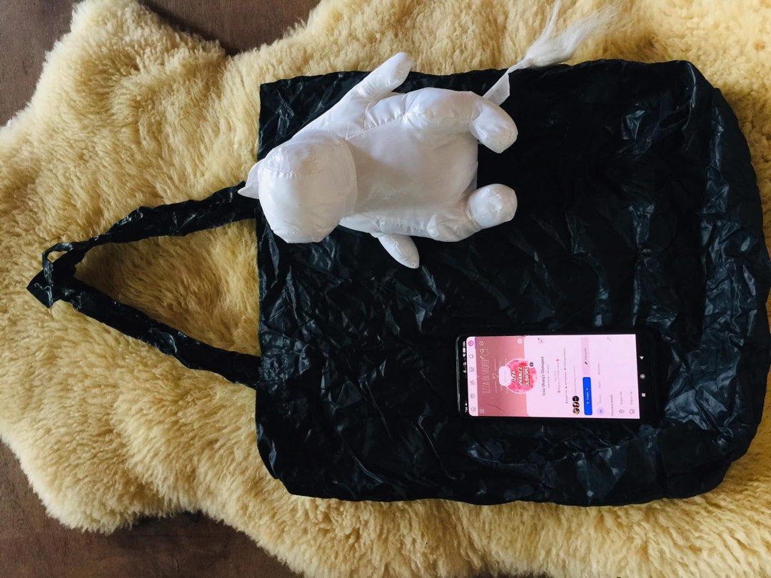 MOOMIN foldable mascot eco bag (Category: Tote Bags) located in Baguio. Submitted by izza_thrifty (Listing ID 1463571567, Image 3). Description: - Adorable Moomin tote bag - Includes a detachable Moomin face pouch with clip - Tote bag is black and made of crinkled material - Ideal for shopping and everyday use - Pouch features a cute Moomin face design.