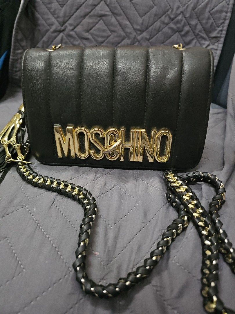 Moschino Bag (Category: Cross-body Bags) located in Manila. Submitted by shopaholicmimi (Listing ID 1463702012, Image 1). Description: preloved with minor flaws. please see photos not cosch, vintage, legacy, ergo, carly, lb, prada, chanel, gucci.