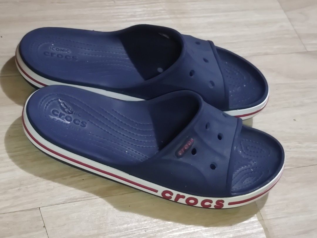 Navy Blue Crocs Comfort Slides Size 8 (Category: Slippers & Slides) located in Dagupan City. Submitted by jhazrightshop (Listing ID 1463692017, Image 3). Description: - Navy blue Crocs comfort slides - Size M6 / W8 - White and red stripe detail on the sole - Ideal for casual wear or around the house.